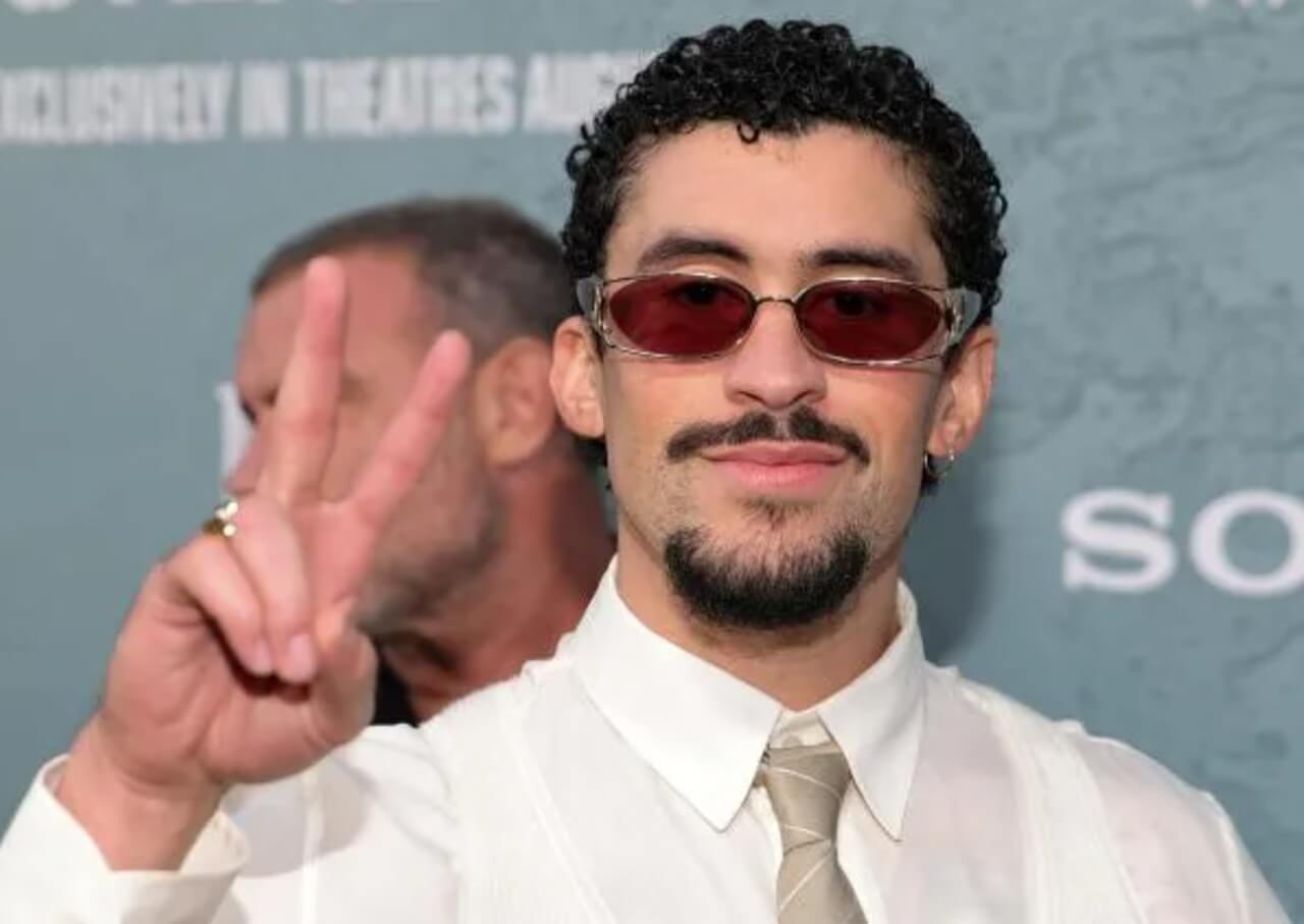 Bad Bunny performing live in bold fashion during a concert.