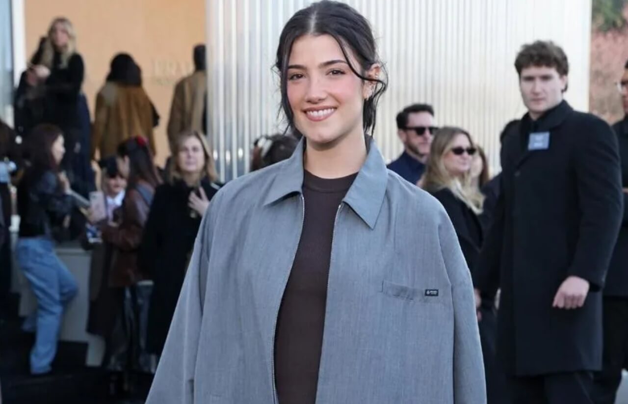 Charli D’Amelio stuns in Prada micro shorts and jacket at Milan Fashion Week.