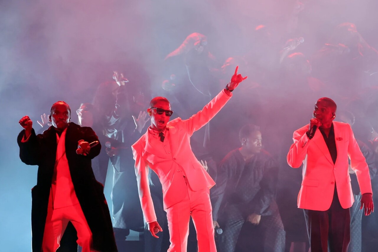 Clipse and Pharrell Williams perform at the 2026 Grammys with choir and snow effects.