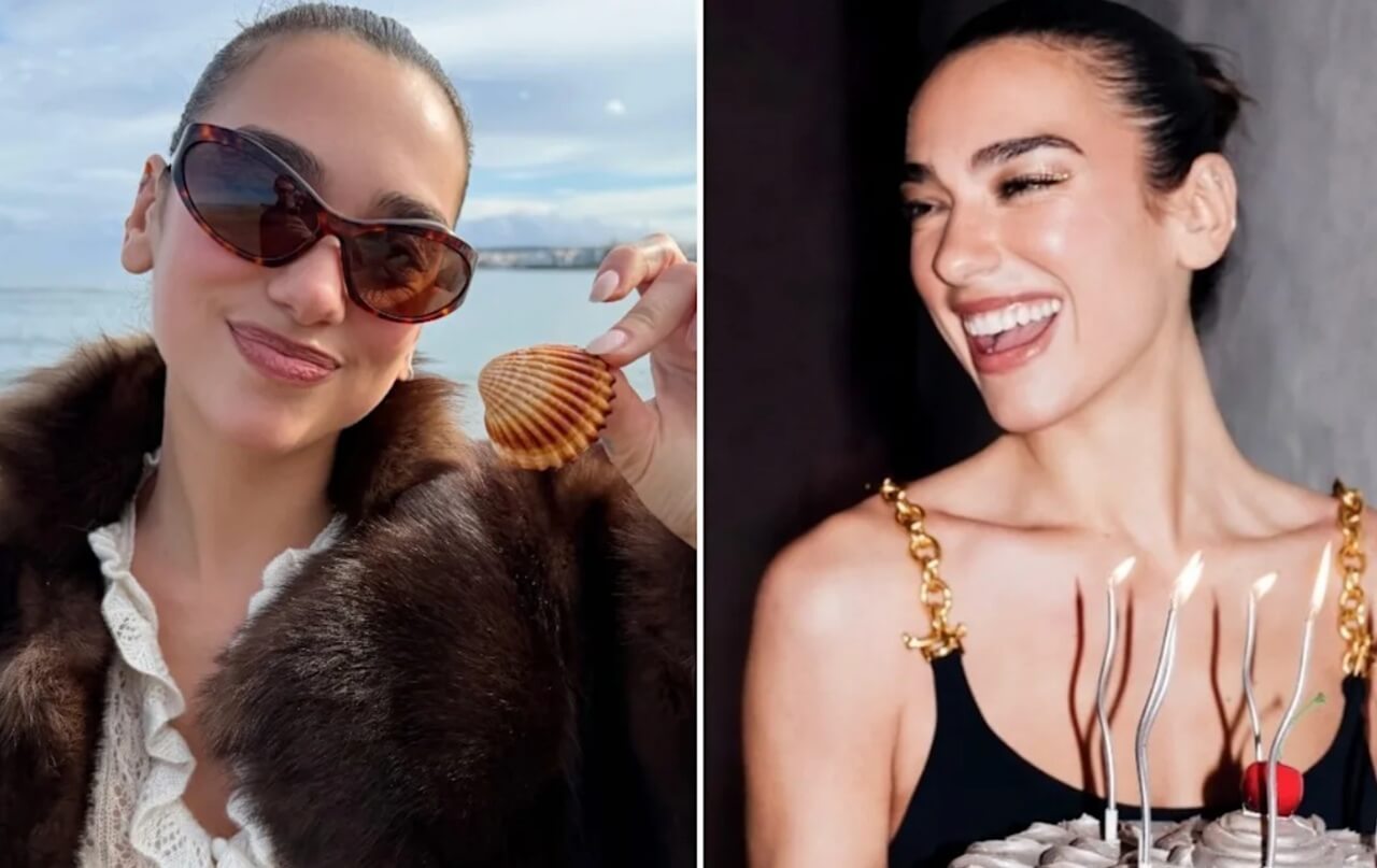 Dua Lipa in coastal chic outfit holding a shell by the ocean.