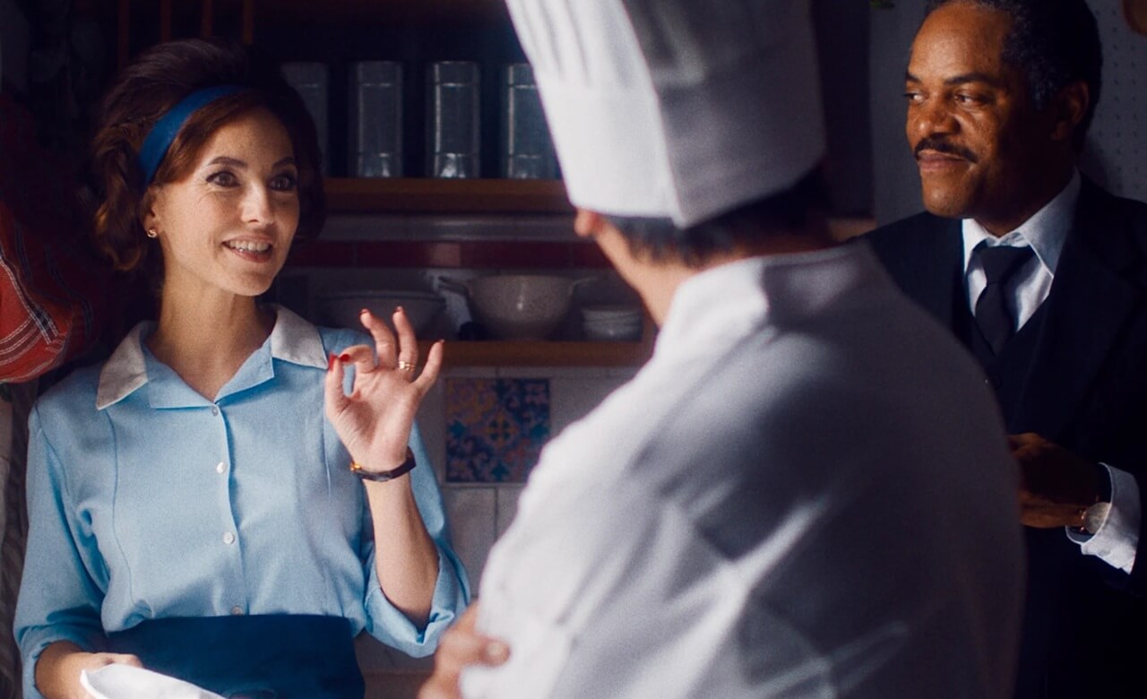 Barbara Mori in Mistura preparing food in a Peruvian kitchen.