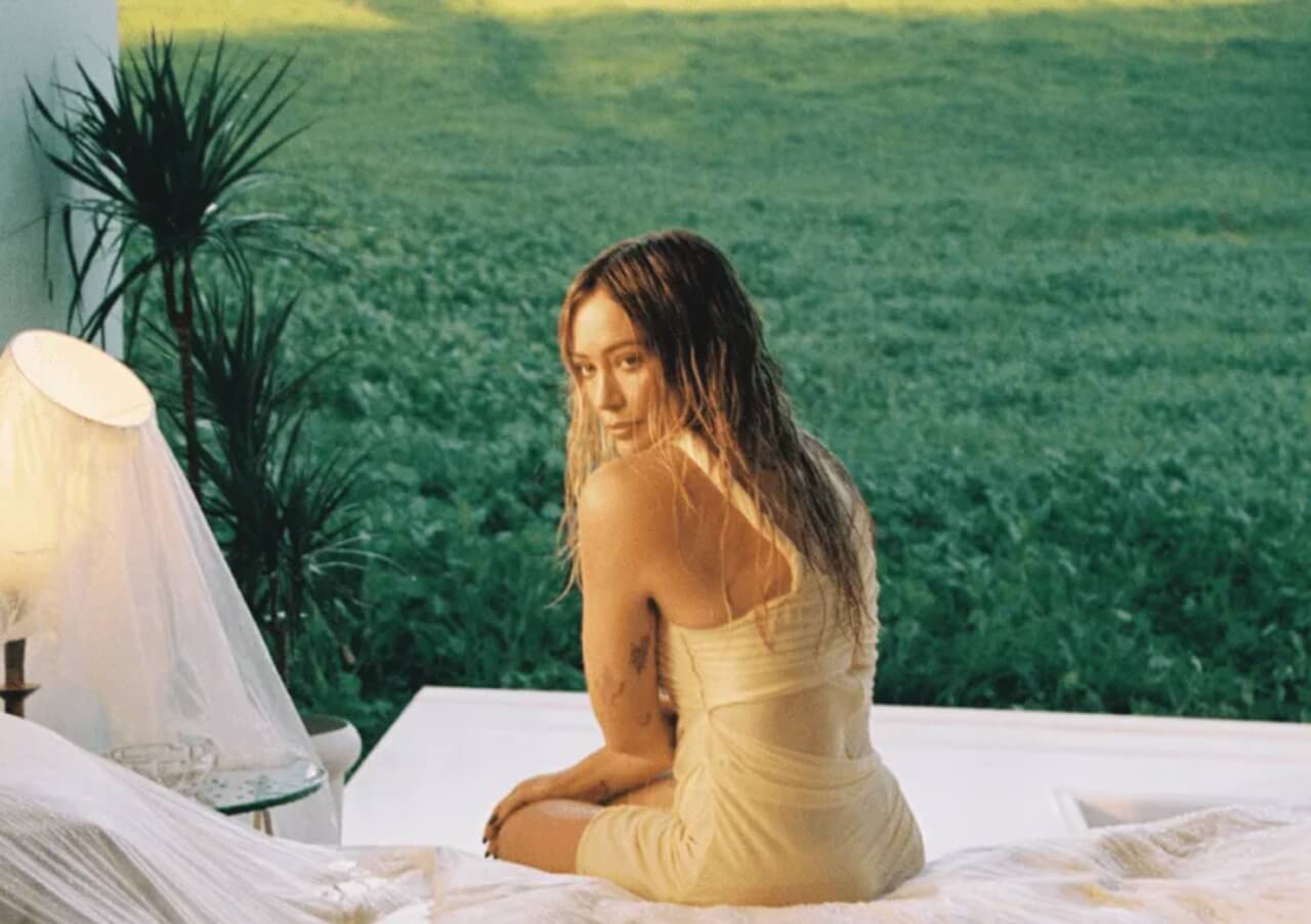 Hilary Duff singing live on stage during her 2026 Lucky Me Tour.