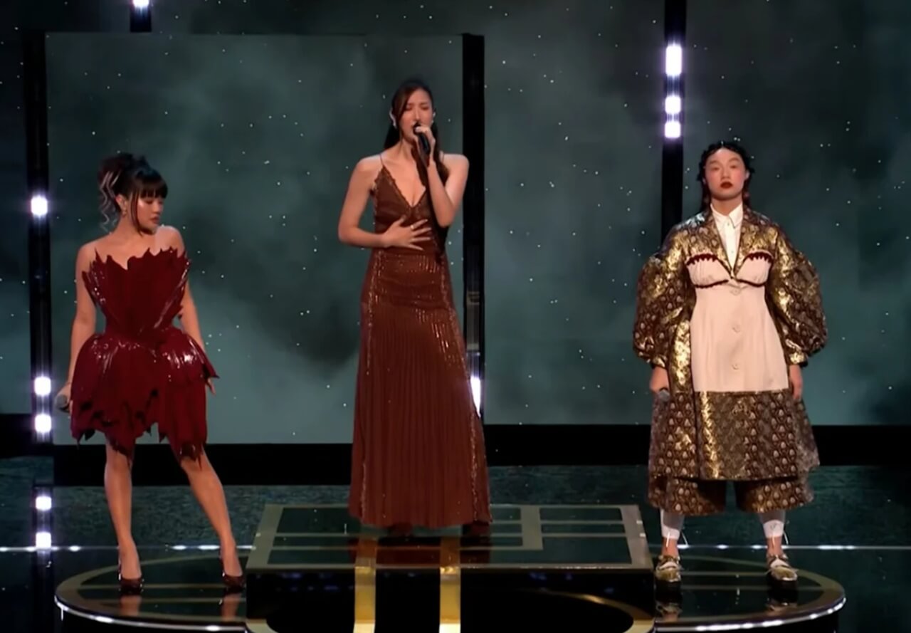 EJAE, Audrey Nuna, and Rei Ami perform “Golden” at BAFTA Awards with dancers and colorful stage lights.