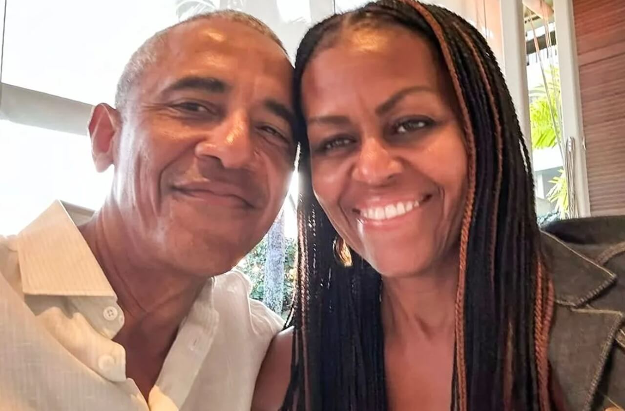 Michelle Obama reveals 10 new ear piercings while smiling with Barack Obama.