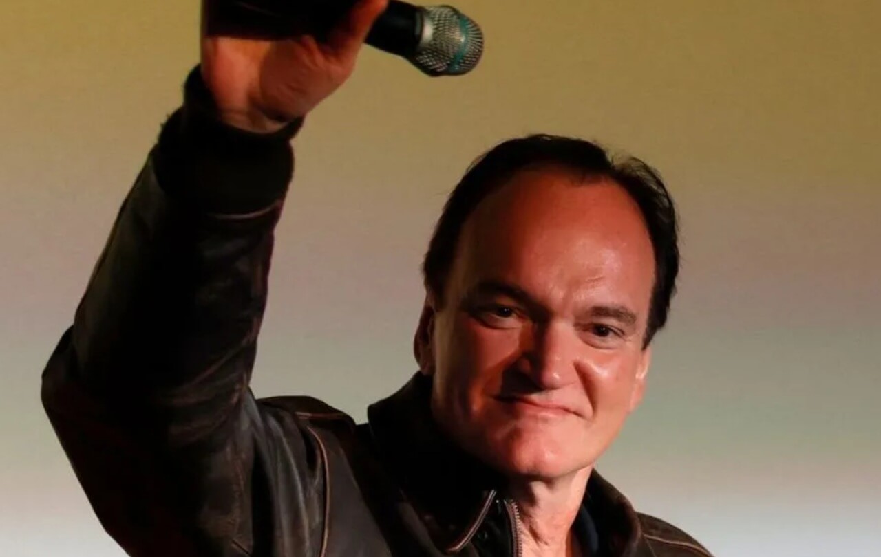 Quentin Tarantino with cast members of Pulp Fiction at a film festival.