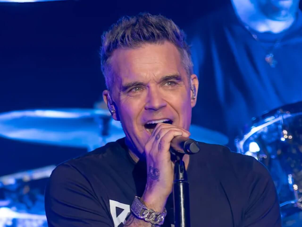 Robbie Williams leads Ozzy Osbourne tribute at BRIT Awards.