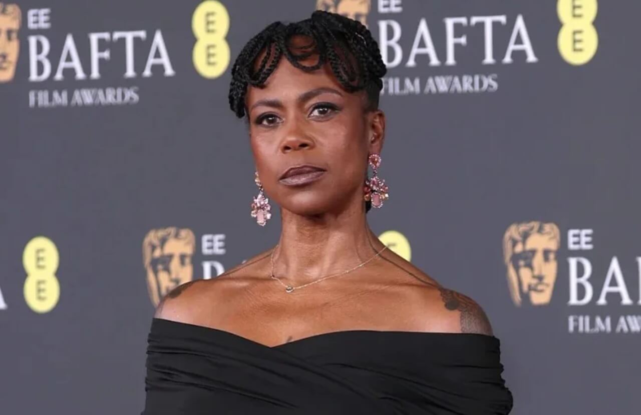 Hannah Beachler attends BAFTA Film Awards 2026 red carpet in black gown.