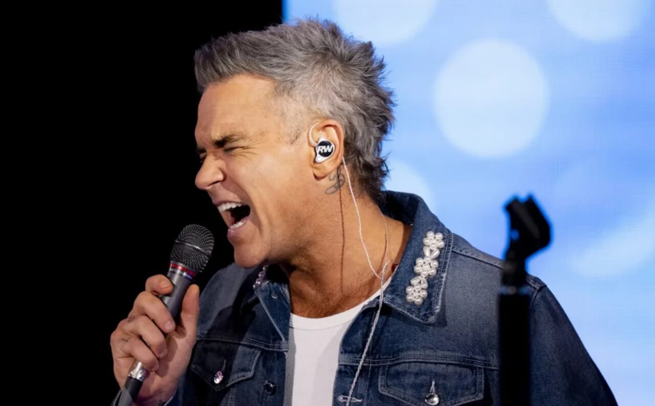"Robbie Williams honored a superfan by attempting to call her number 30 years later."