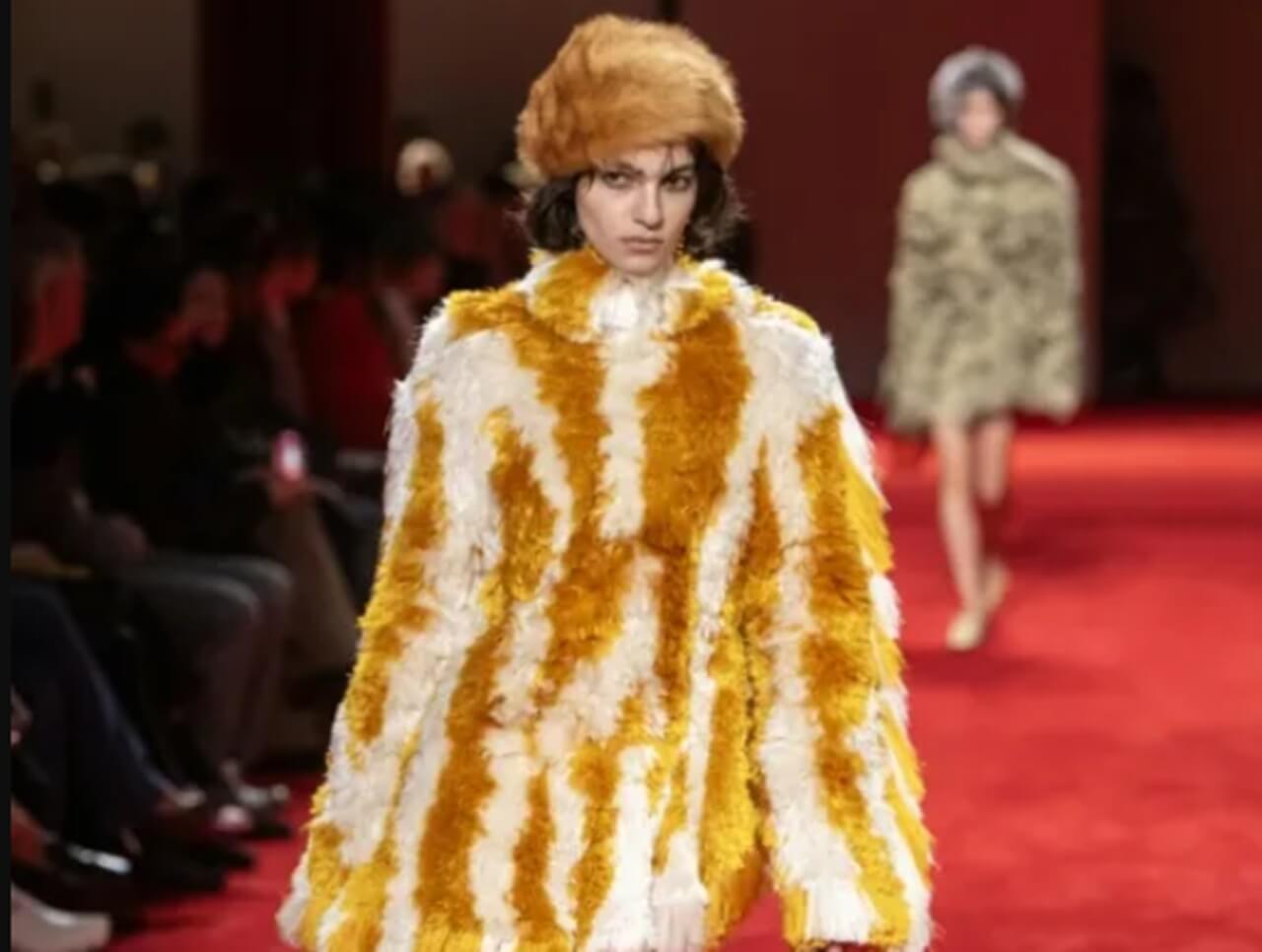 Model in recycled fibreglass coat at Bottega Veneta Fall/Winter 2026 show, Milan Fashion Week.