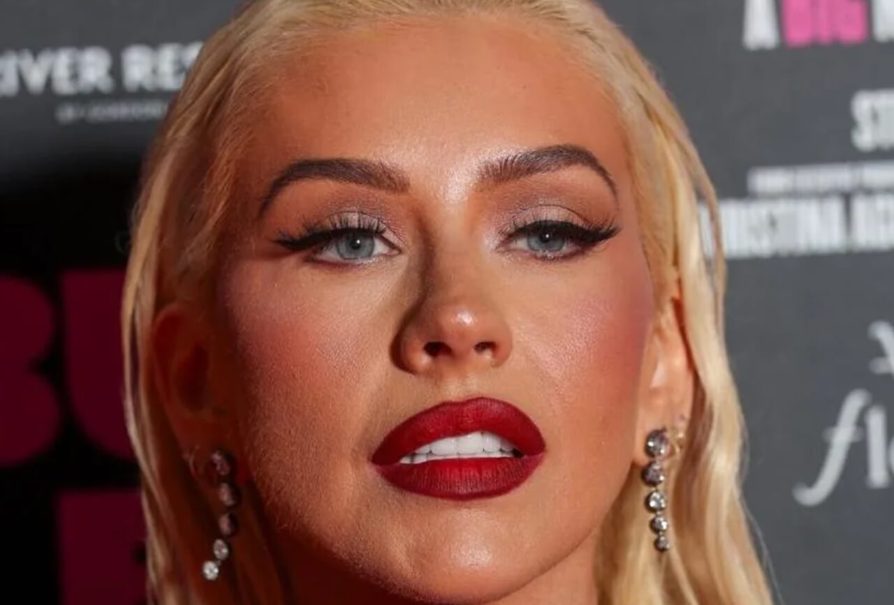 Christina Aguilera stuns in red leather bodysuit and faux-fur coat during Austin performance.