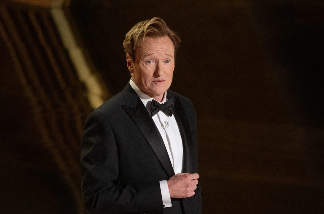 Conan O’Brien eating spicy wings on Hot Ones in viral episode.