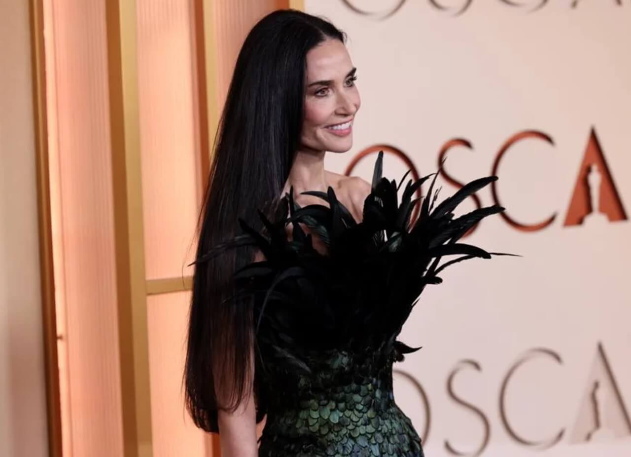 Demi Moore stuns at Oscars 2026 with sleek silk-pressed hair and Gucci gown.