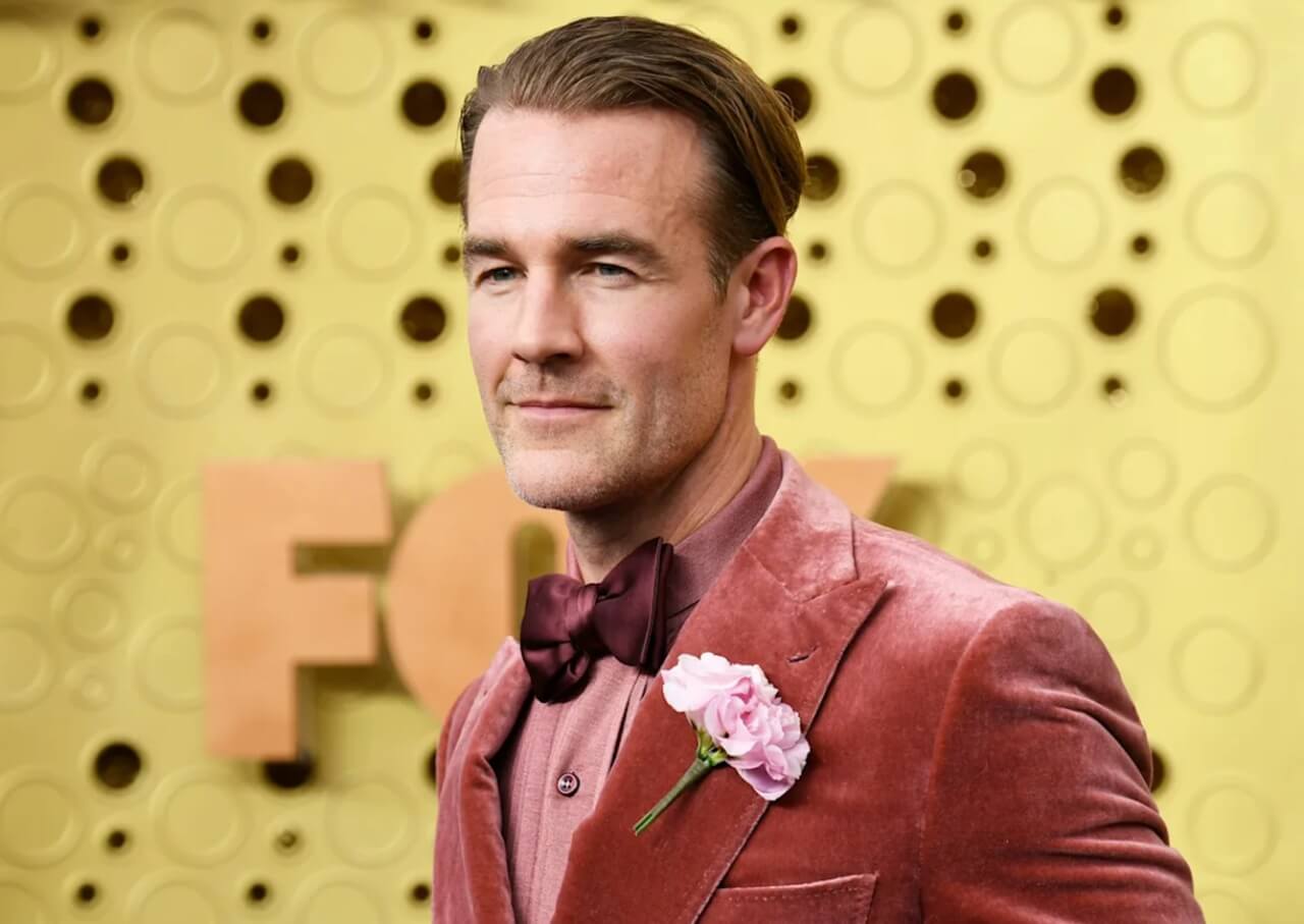 James Van Der Beek with wife Kimberly and their six children, smiling together at a family event.