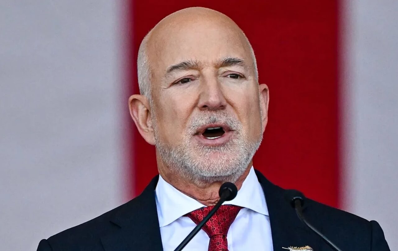 Jeff Bezos and Mark Zuckerberg at Fashion Week front row, drawing criticism.