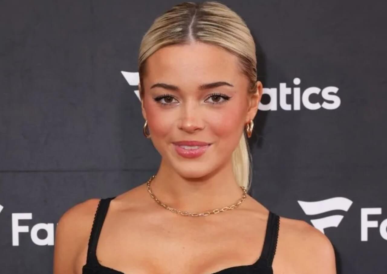 Livvy Dunne debuts as Grace in Fox’s Baywatch reboot, wearing a cutout swimsuit on the beach.