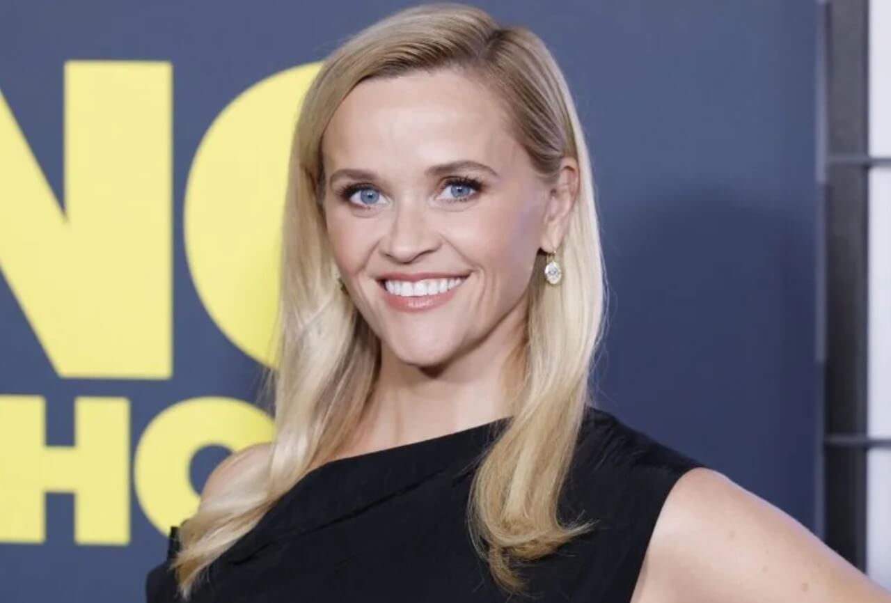 Reese Witherspoon on red carpet celebrating her 50th birthday.