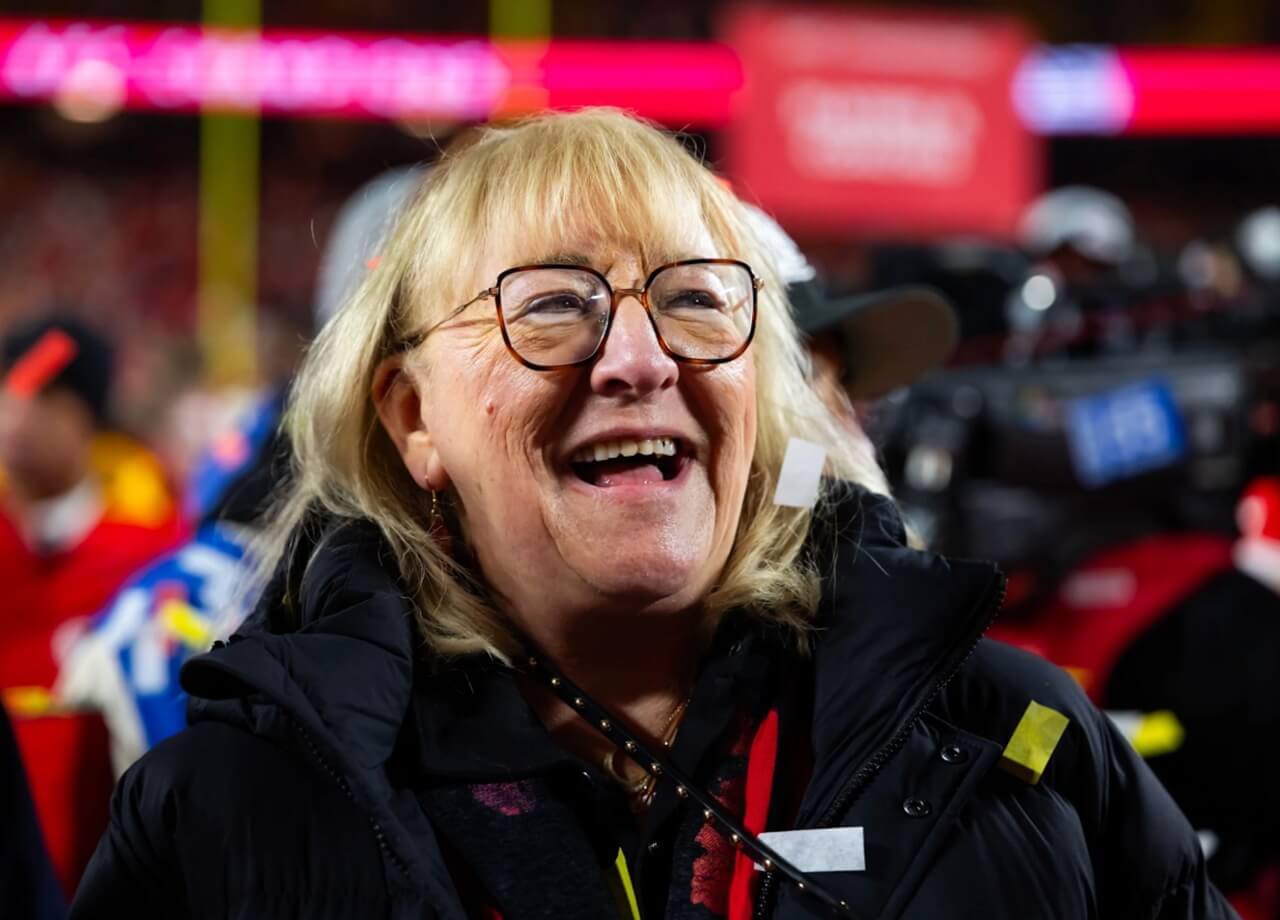 Donna Kelce smiling at a football game next to paint swatches and renovation tools, symbolizing the viral meme.